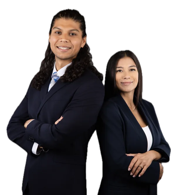 Israel Medina and Rikki Medina, car accident attorneys at Medina & Medina in Austin, Texas, standing back to back